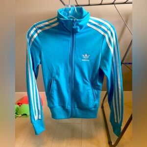 Woman’s Original Adidas Zip Jacket. Light blue. Size XS.